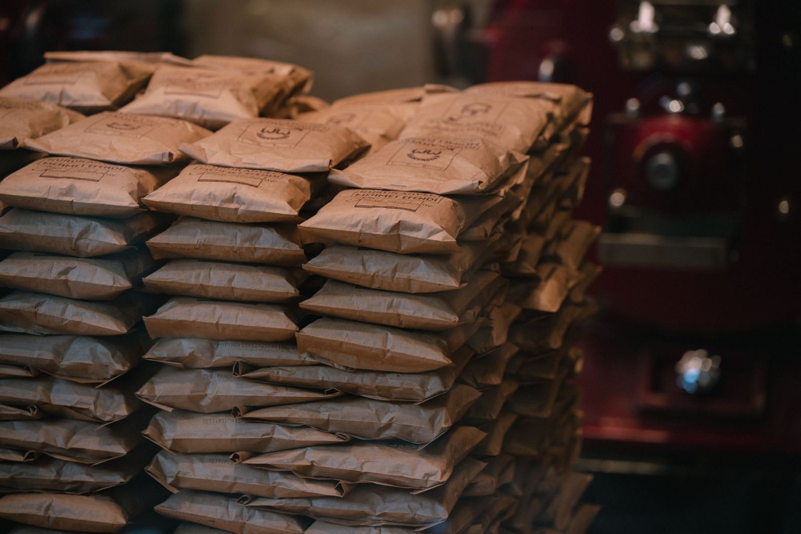 Bags of material stacked on pallets in a warehouse